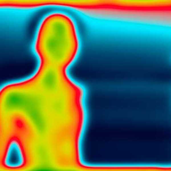 A heat image of a person silhouetted against a blue background