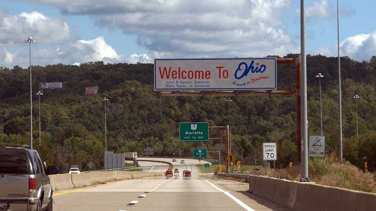 A highway with a sign saying Welcome to Ohio
