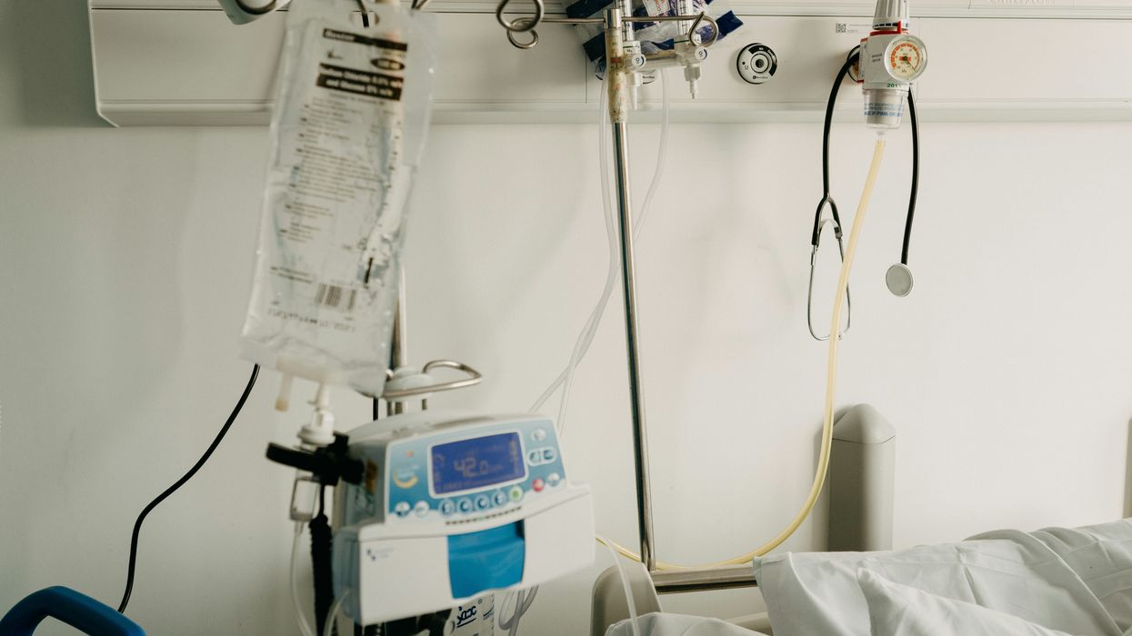 a hospital room with a bed and medical equipment