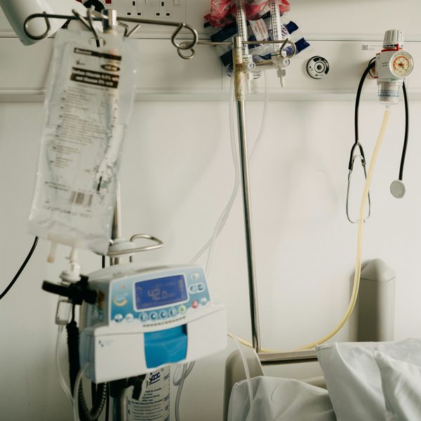 a hospital room with a bed and medical equipment