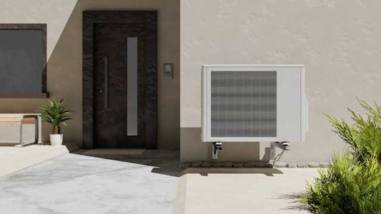 A house with a heat pump installed on the side of it