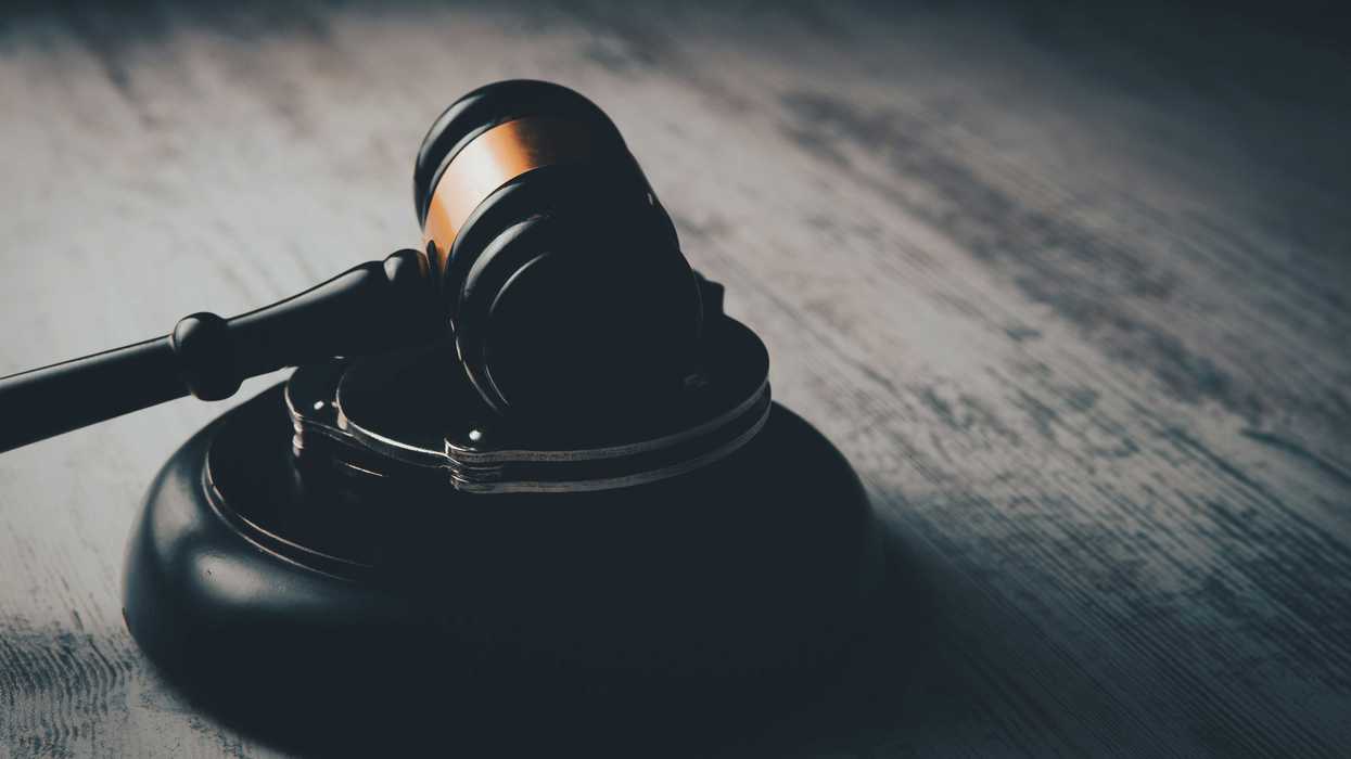 a judge's gaven on a wooden table.