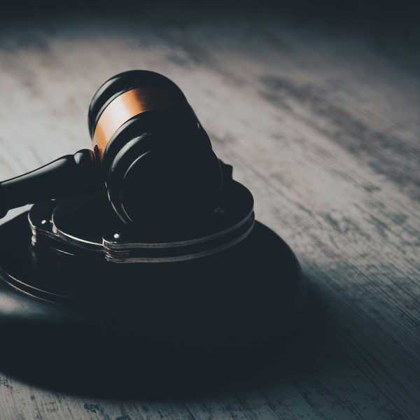 a judge's gaven on a wooden table.