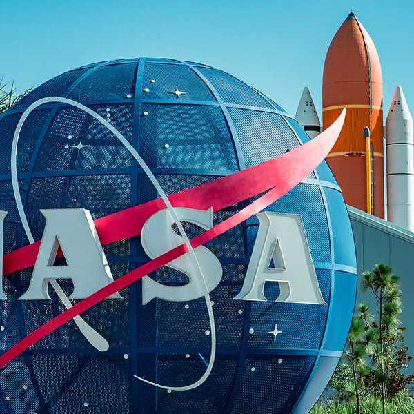 A large blue globe with the letters NASA on it