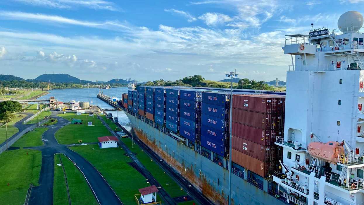 a large cargo ship in MIraflores Lock at Panama Canal.