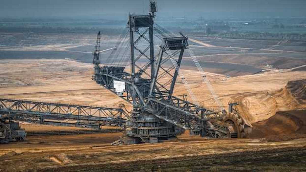 A large crane digging earth