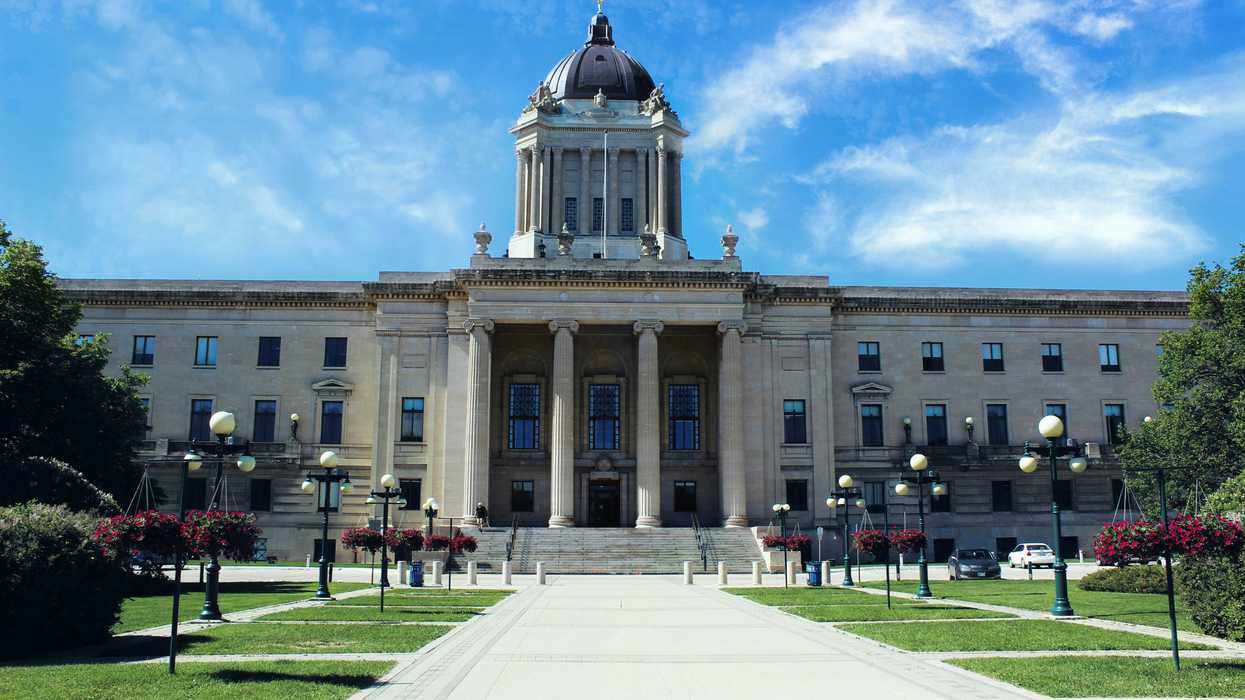 a large government building with a clock tower on top of it