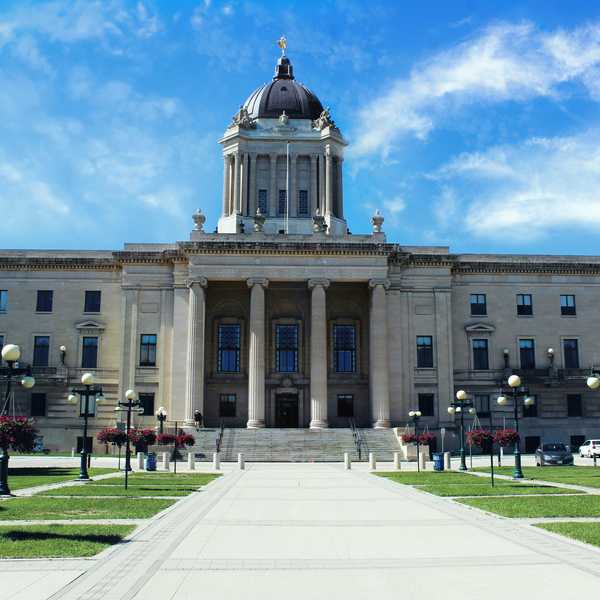 a large government building with a clock tower on top of it