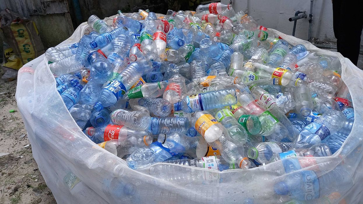 a large number of used plastic bottles in a bag