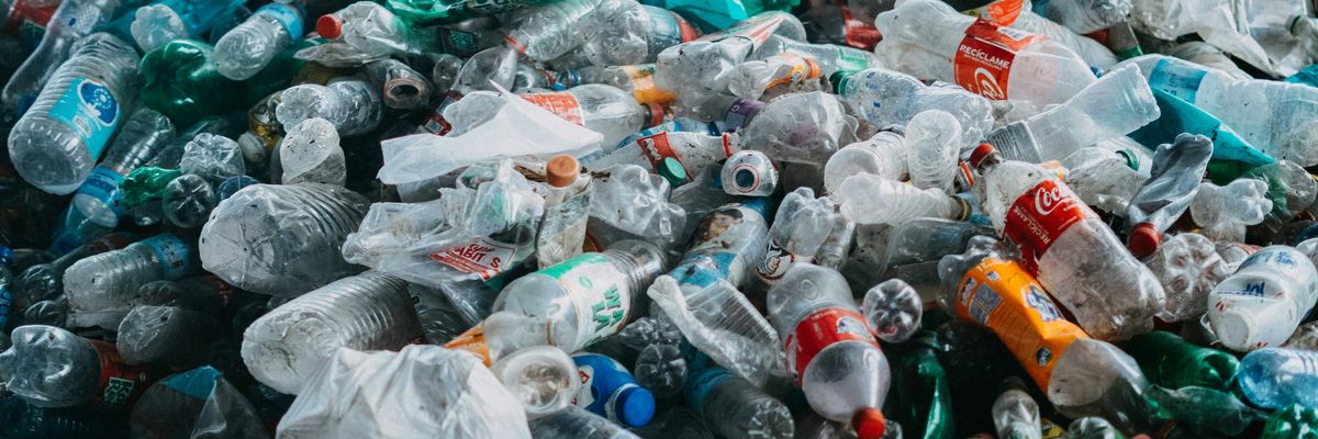 A large pile of plastic bottles