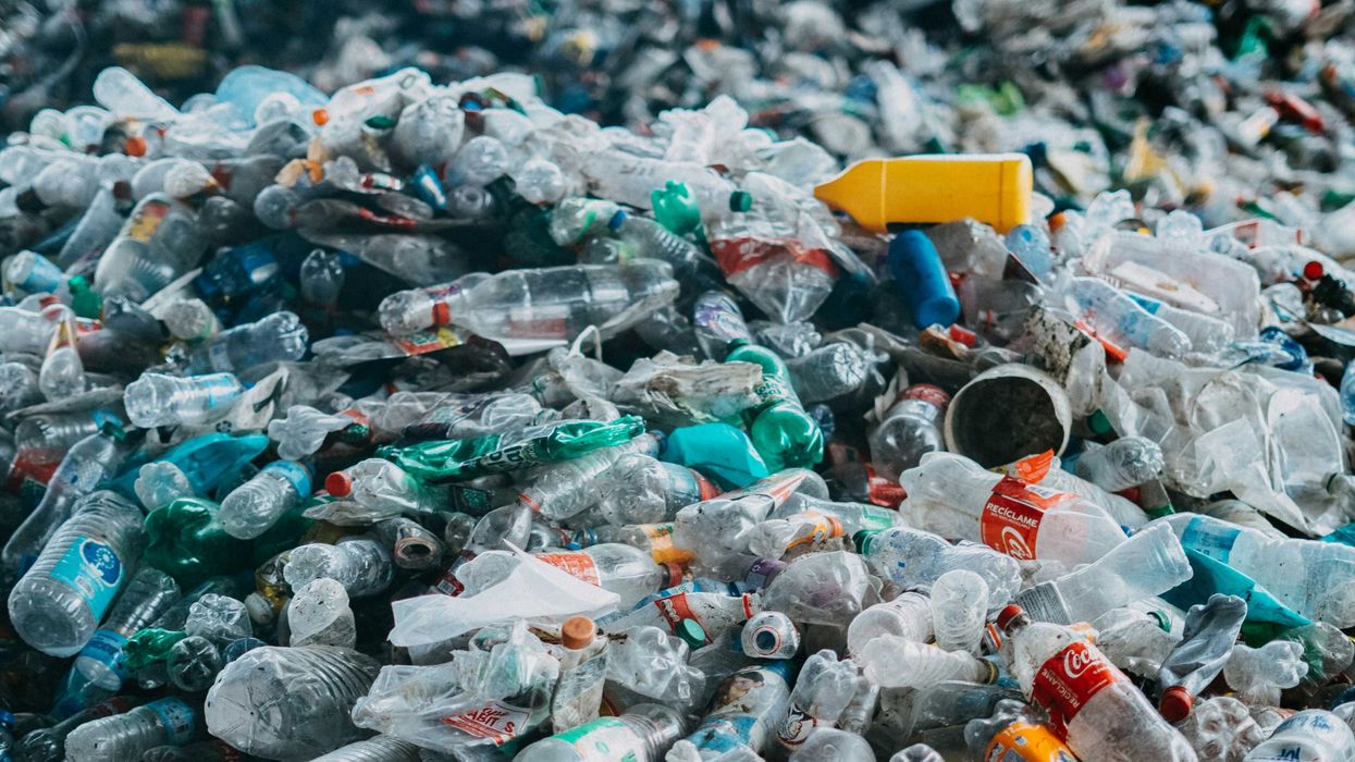 A large pile of plastic bottles