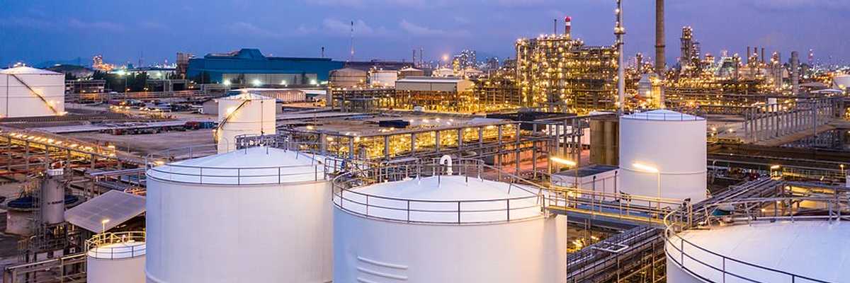 A liquid natural gas facility with storage silos.