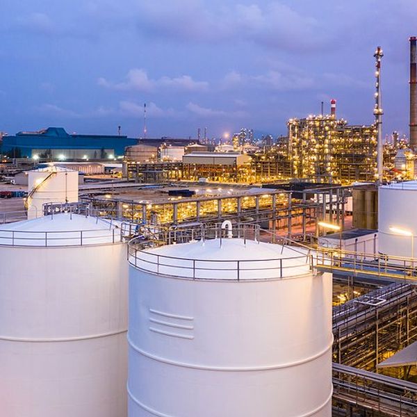 A liquid natural gas facility with storage silos.