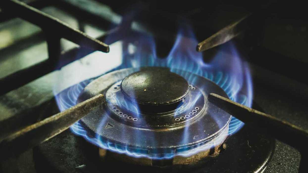 A lit gas stove burner.