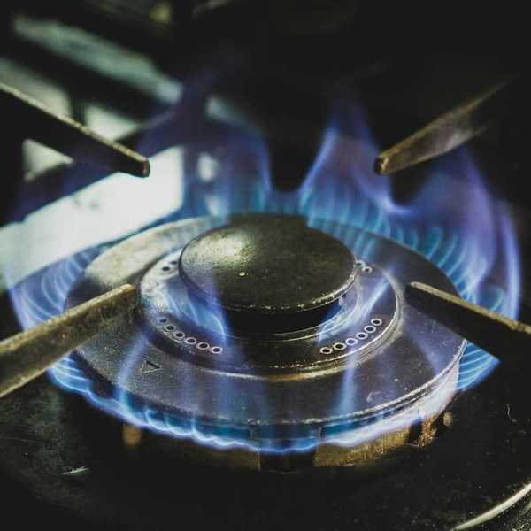 A lit gas stove burner.