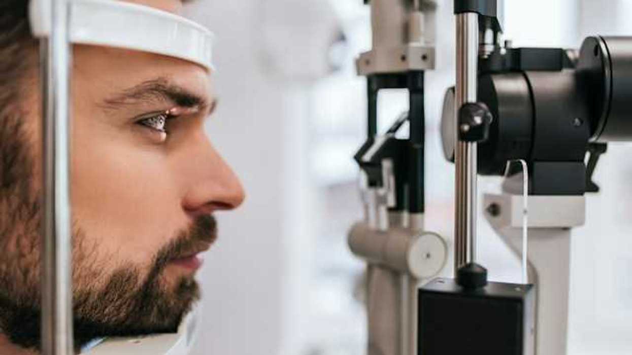 A man's head being viewed in an ophthalmology machine