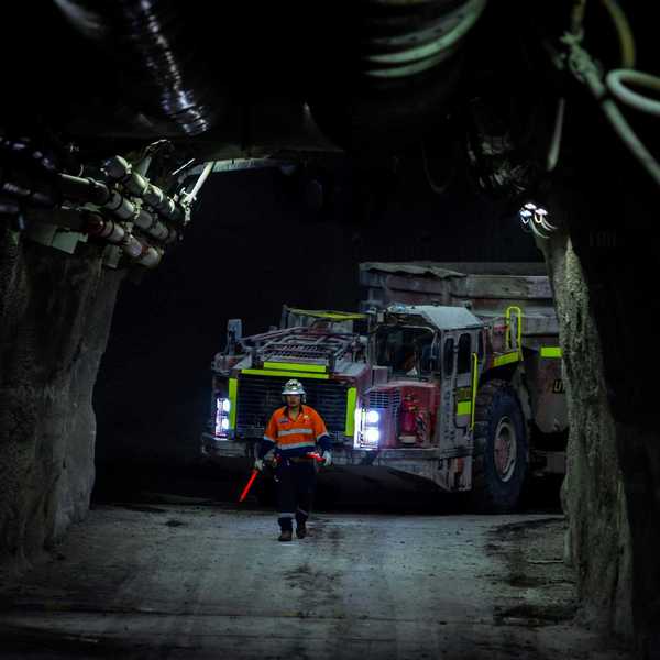 A person standing in a mining tunnel.