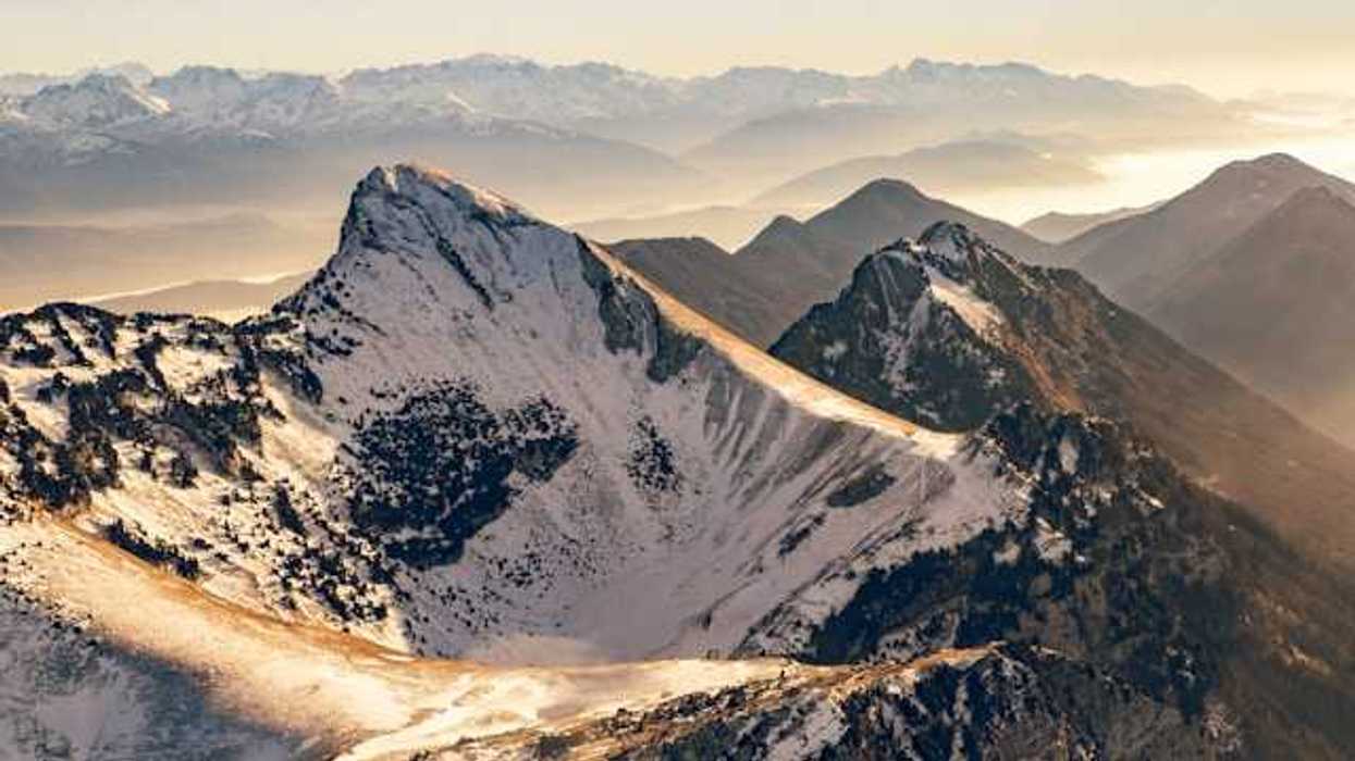 A photo of snow-capped French alps during the golden hour