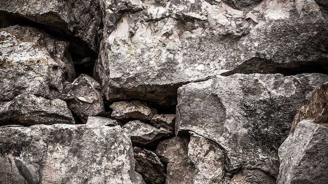 A pile of boulders in a black and white photo