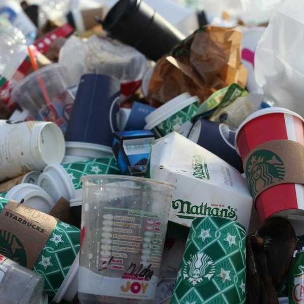 A pile of coffee-to-go cups and takeout packaging