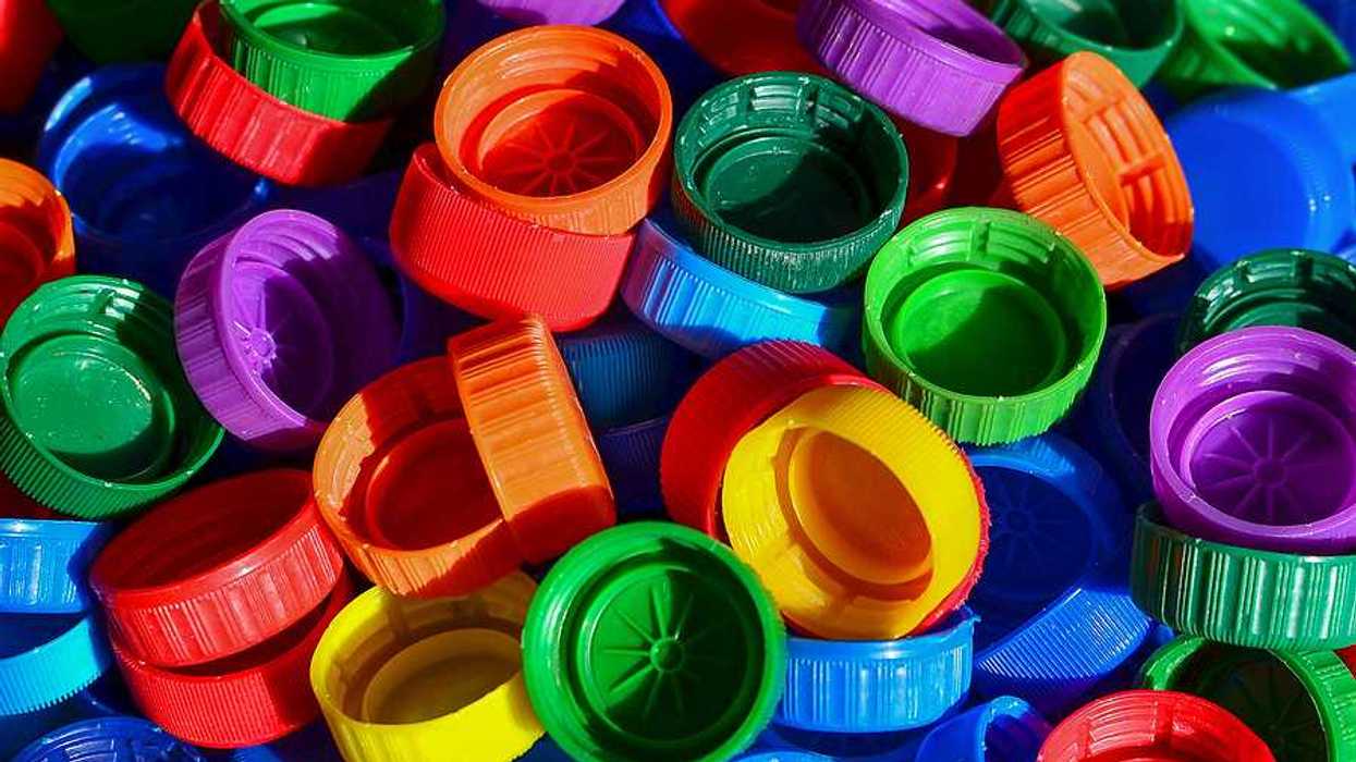 A pile of multicolored plastic bottle caps