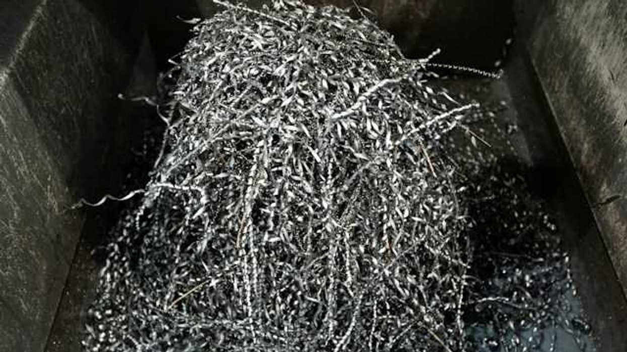 A pile of shredded metal in a bin