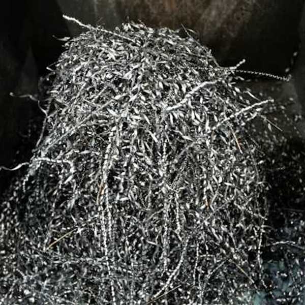 A pile of shredded metal in a bin