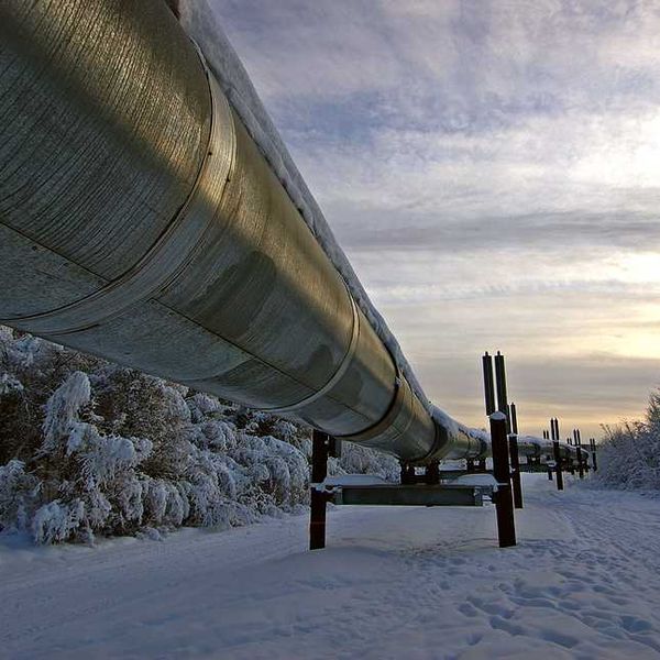 A pipeline stretching across a snowy landscape