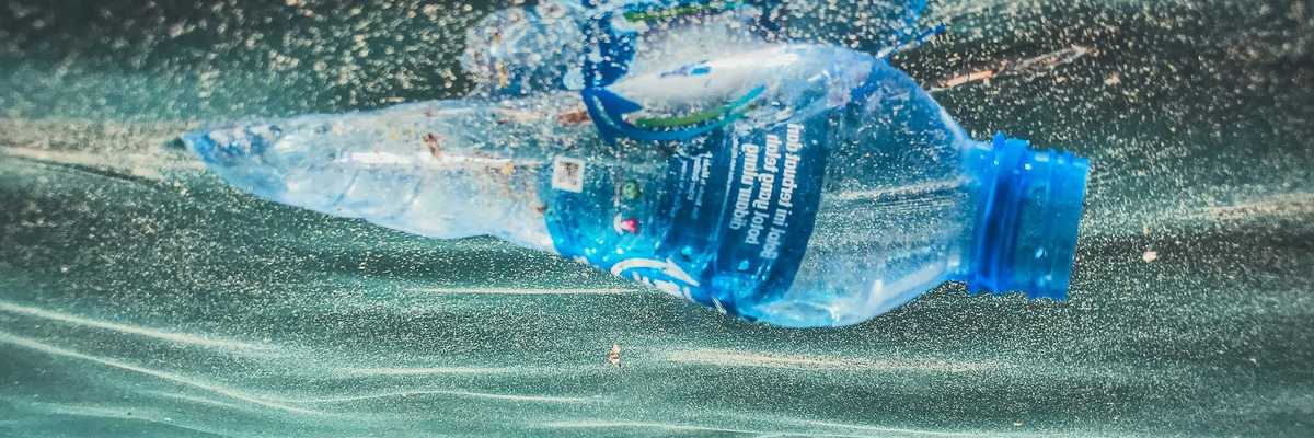 a plastic bottle floating in the water.