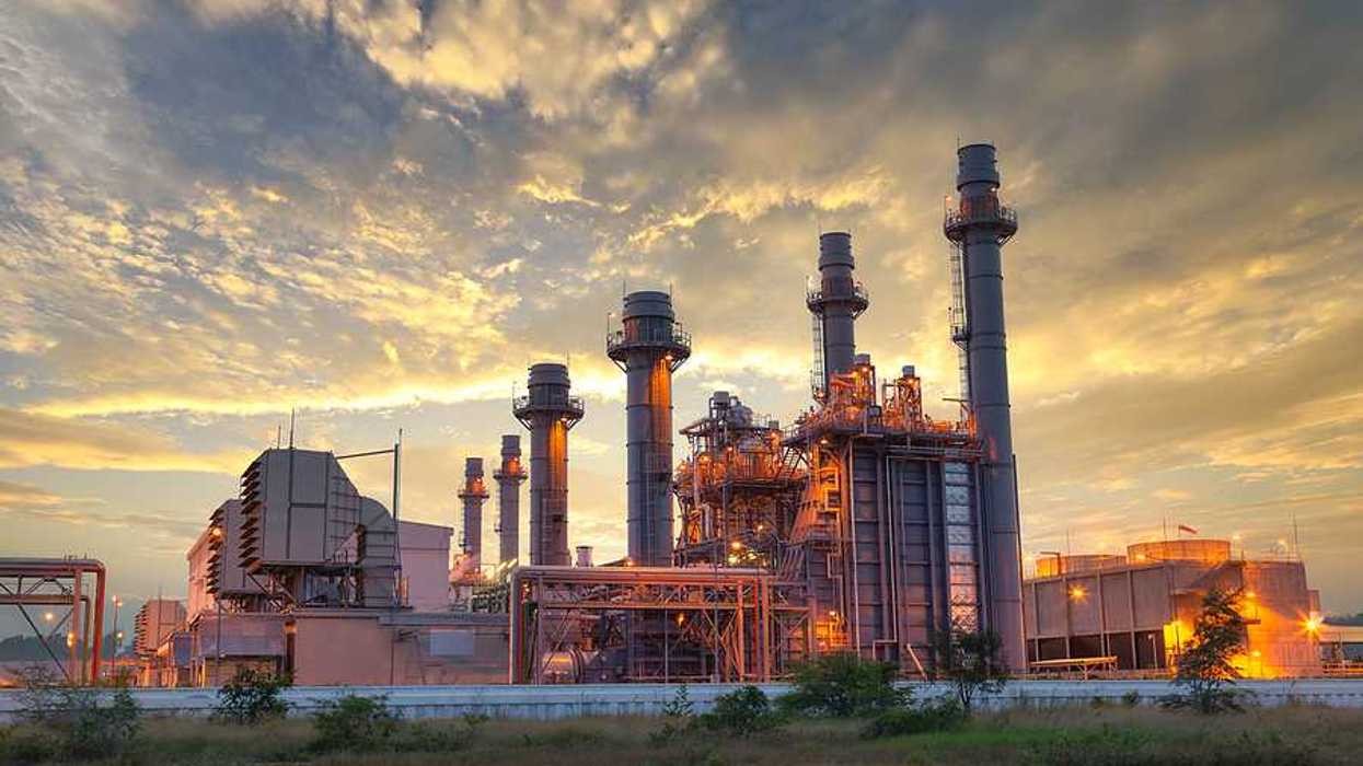 A power plant against a cloudy sky