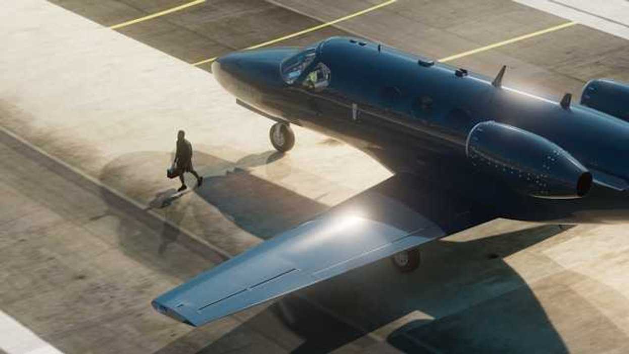 A private plane painted black sitting on the tarmac