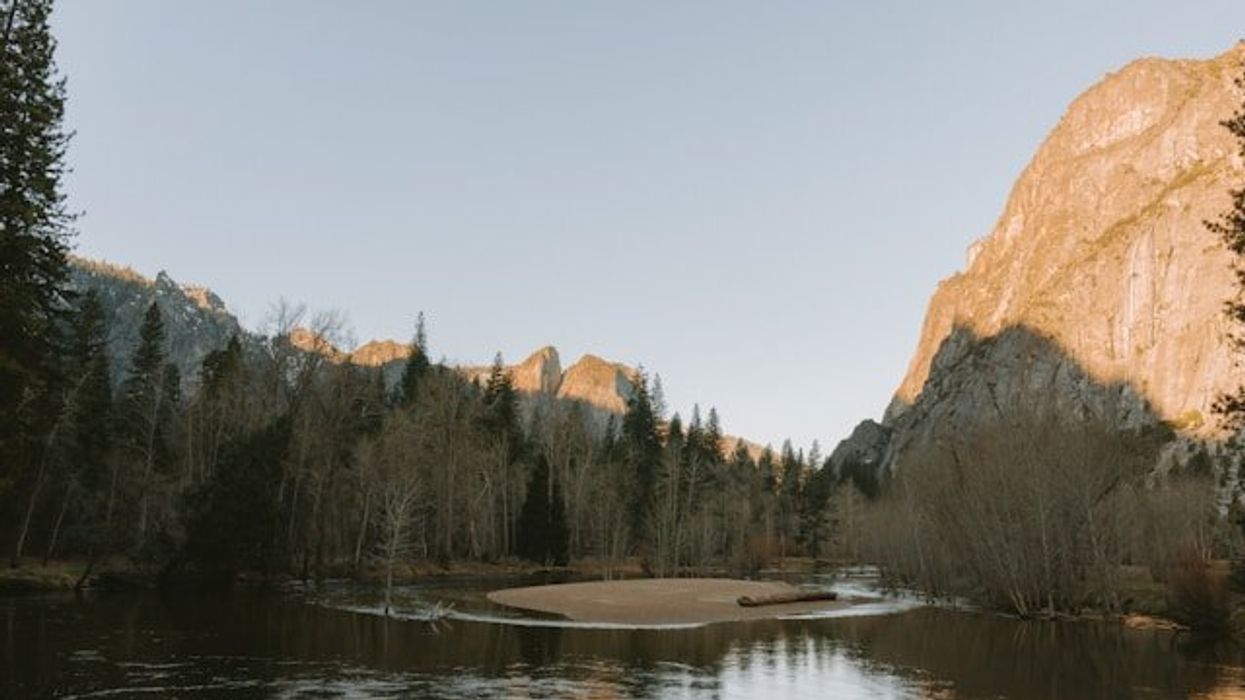 A river running between rocky hills.