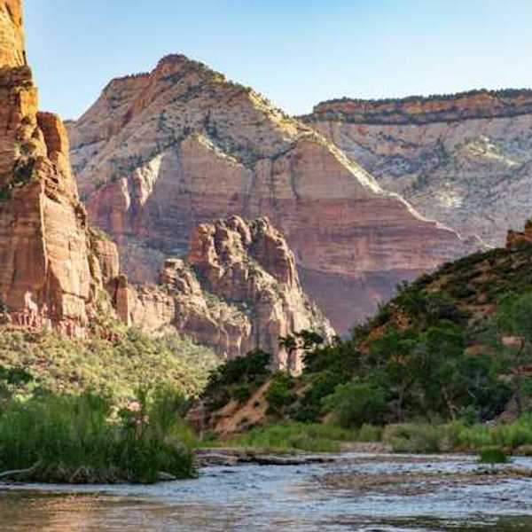 A river running through a lush green valley in the western U.S.