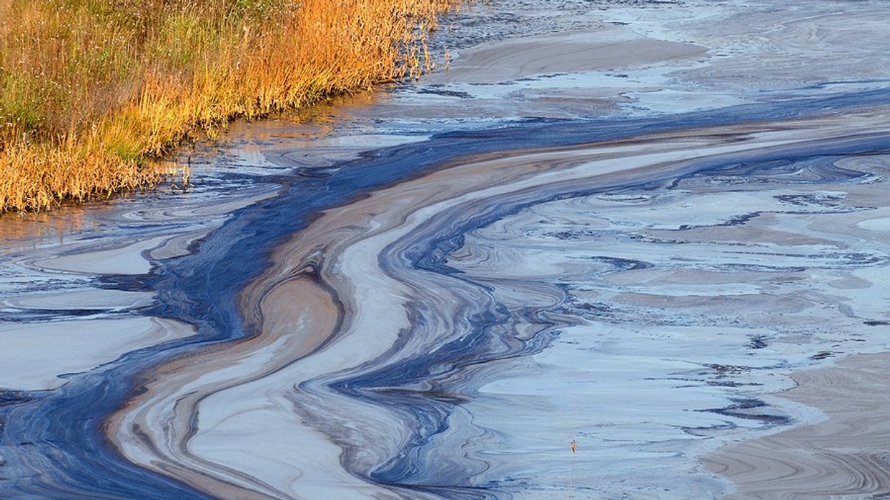 A river with an oily substance on top of the water