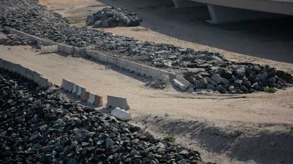 A road with coal piled up in rows