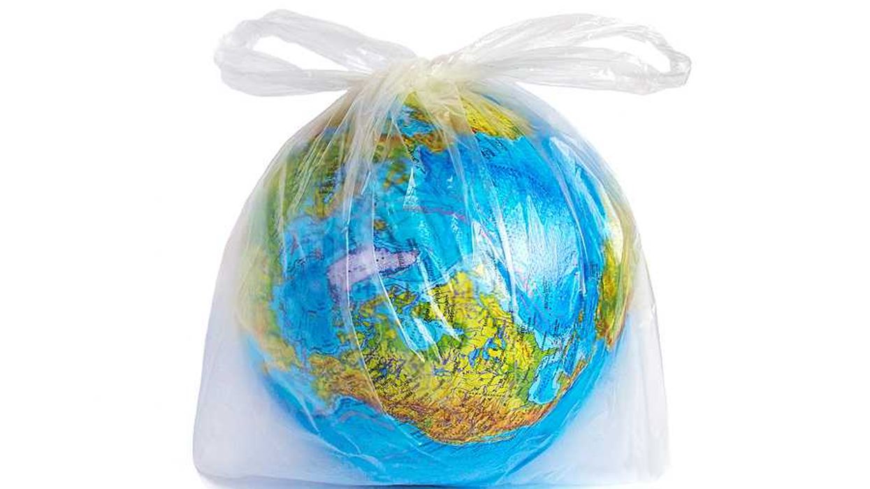 A round globe wrapped in a plastic bag