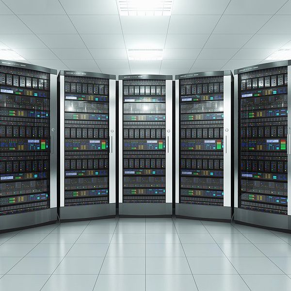 A row of data servers in a white room.
