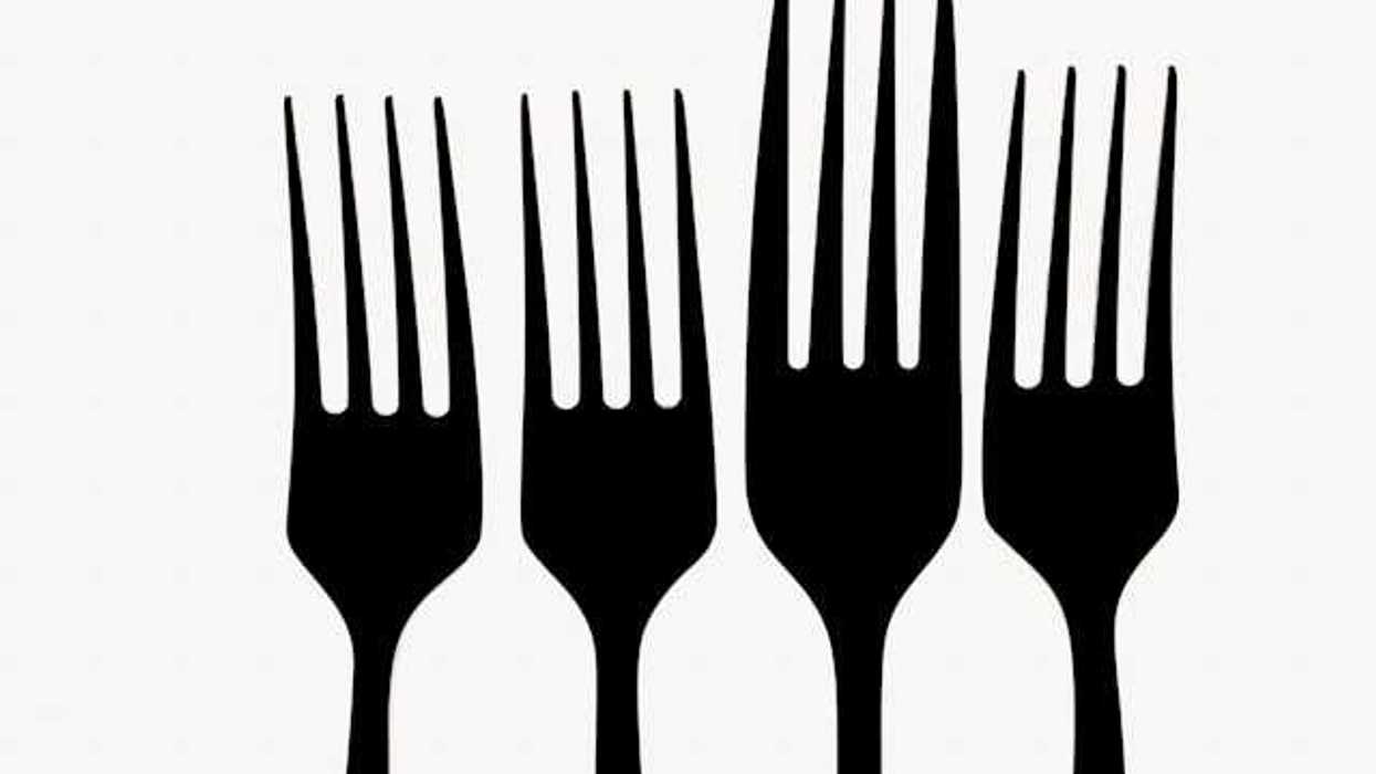 A row of forks against a white background