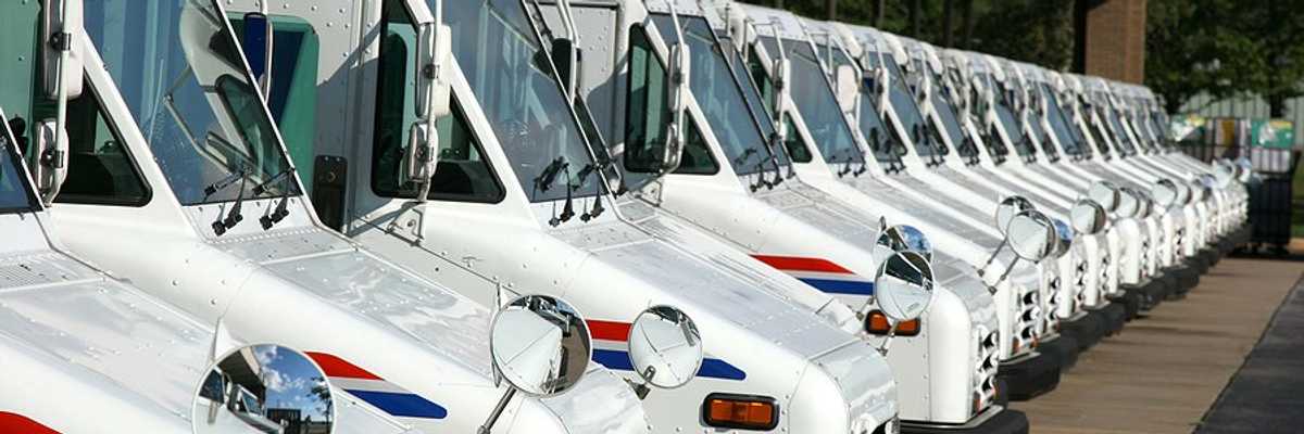 A row of USPS postal vans.