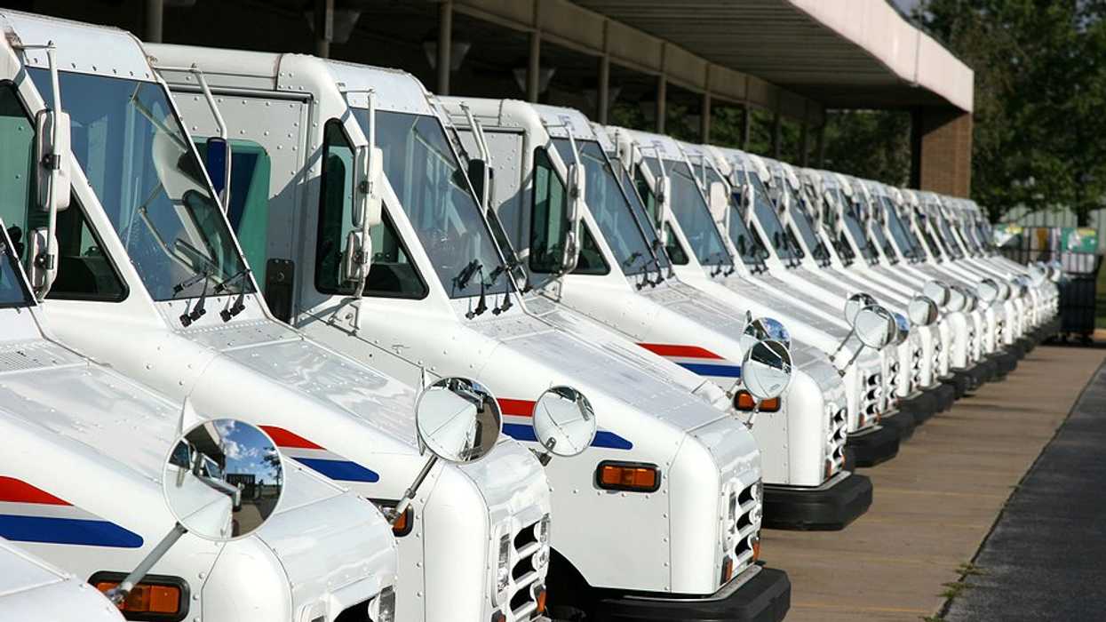 A row of USPS postal vans.