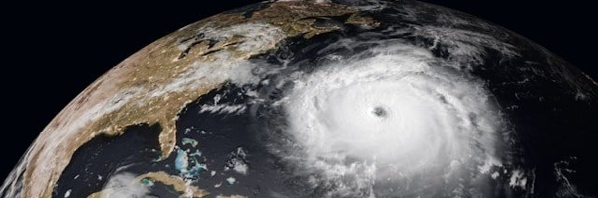 A satellite photo of a hurricane off the east coast of the United States.