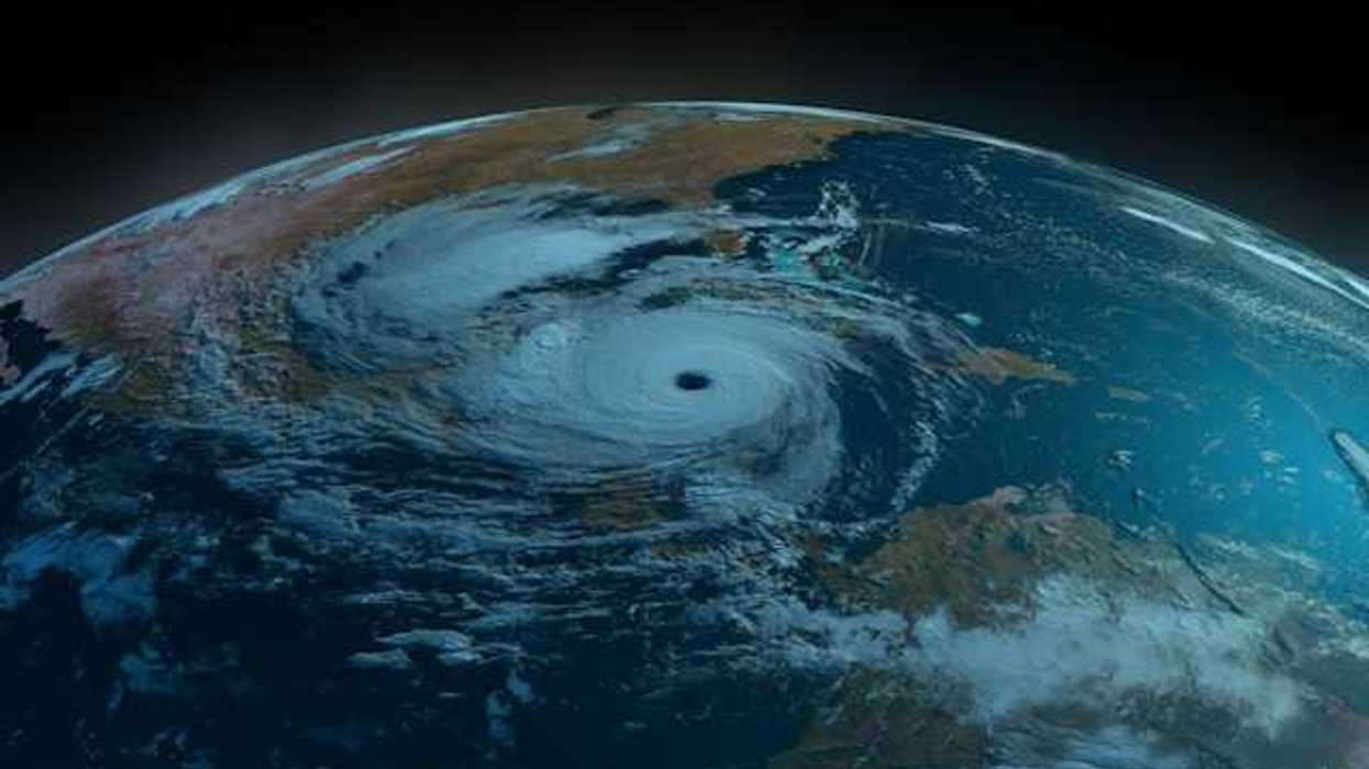 A satellite view of the earth showing a swirling hurricane off the Gulf Coast