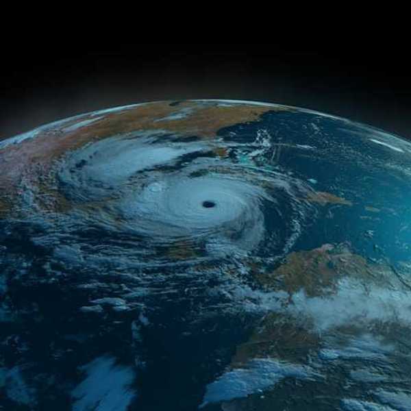 A satellite view of the earth showing a swirling hurricane off the Gulf Coast