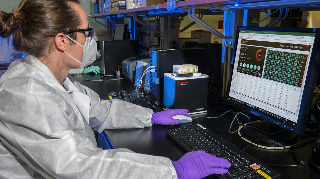 A scientist runs models on a computer