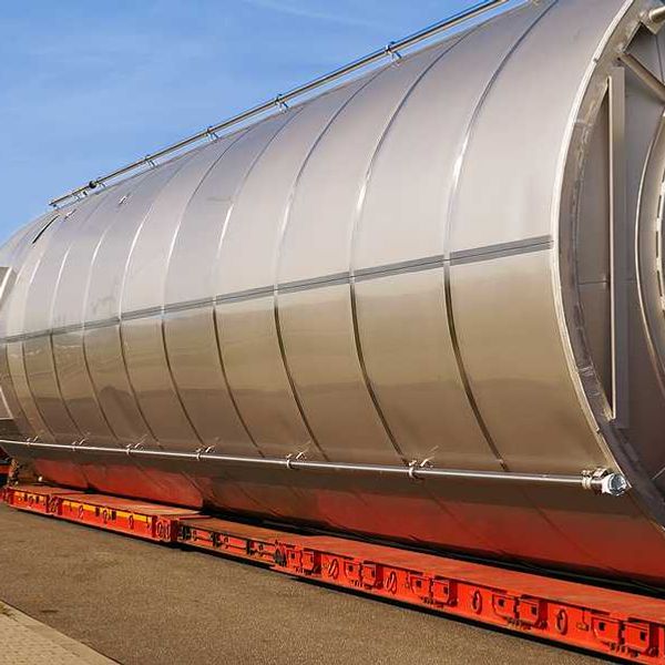 A semi truck hauling a large gas container