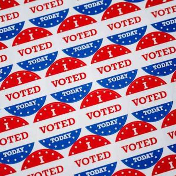 A sheet of 'I voted' stickers in red white and blue