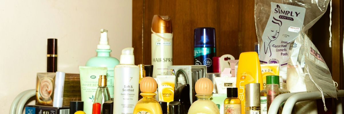 A shelf filled with lotions and personal care products in plastic bottles