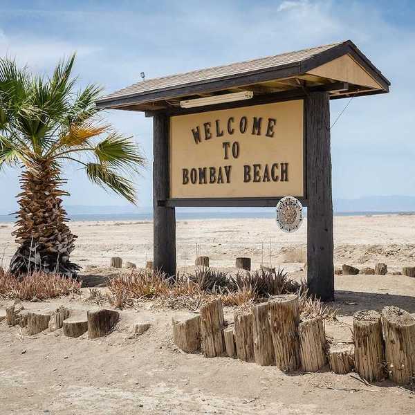 A sign welcomes visitors to Bombay Beach, a partially abandoned town on the shores of the Salton Sea.