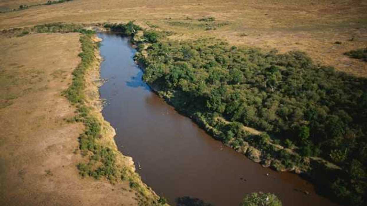 A small river winding through a dry environment