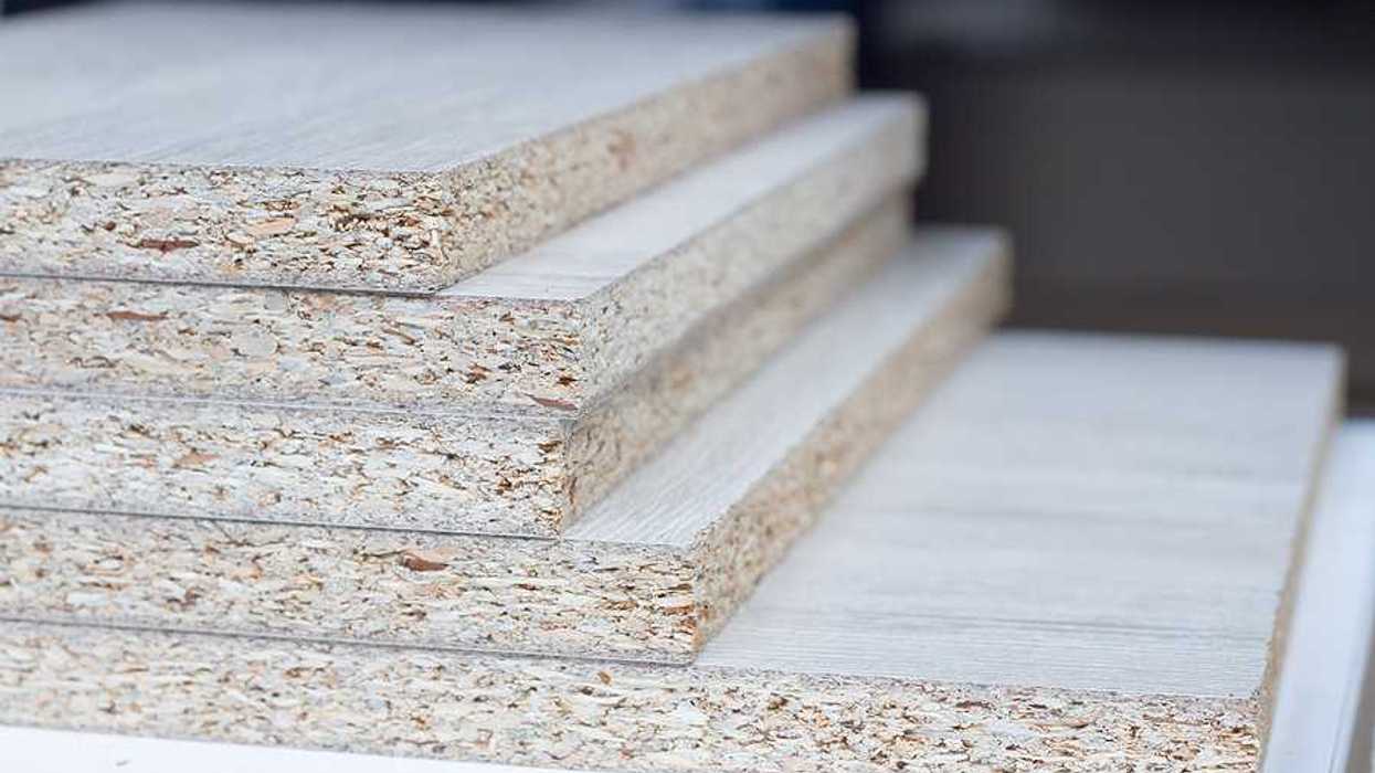 A stack of particle board viewed from the side